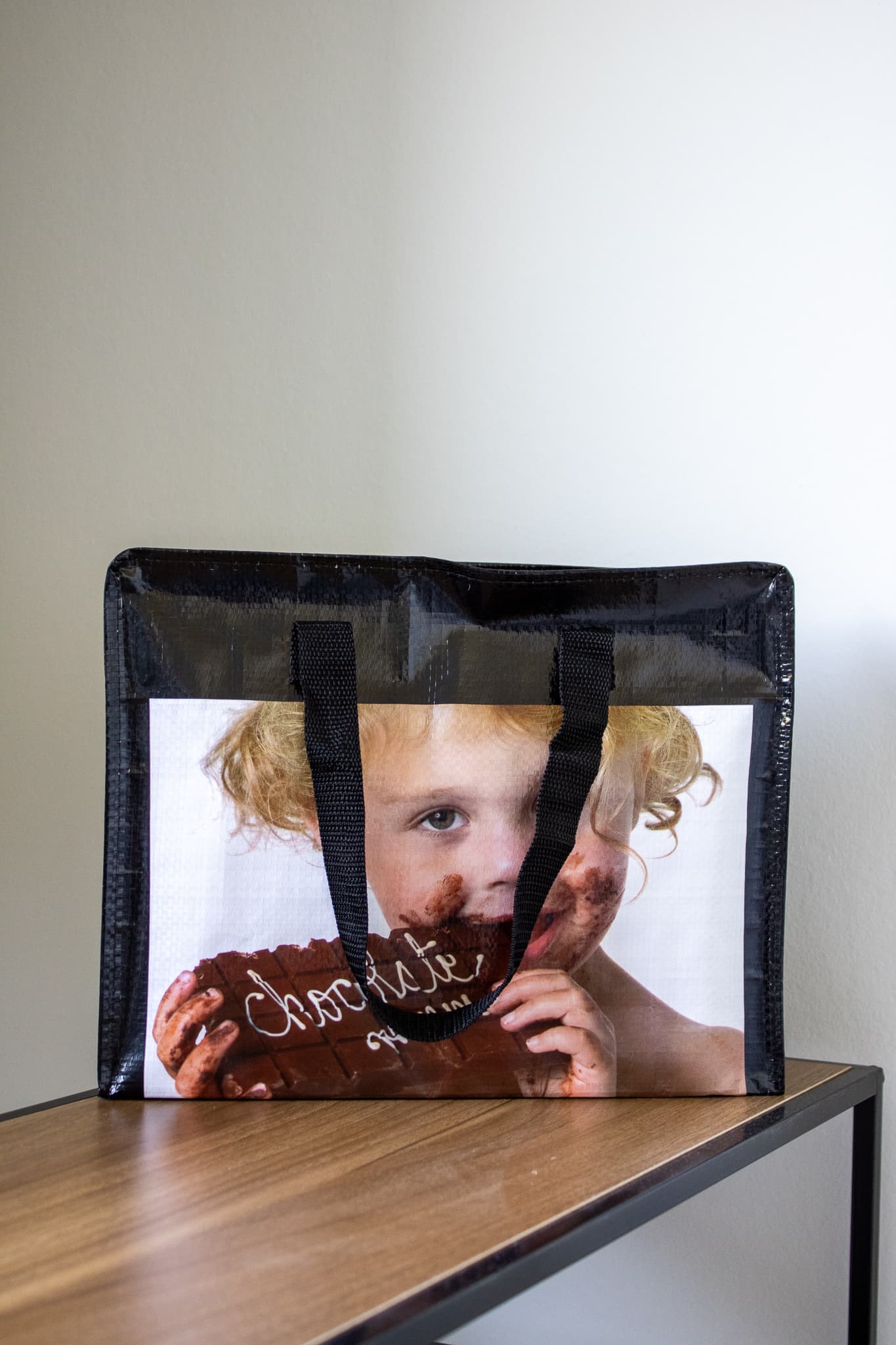 Bedrukte woven draagtas voor chocolatier Dumon met afbeelding van kind en chocolade